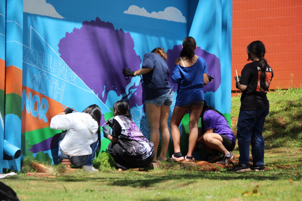 Pearl City High School’s DRIVE WITH ALOHA mural painting project got underway on the school campus Saturday morning