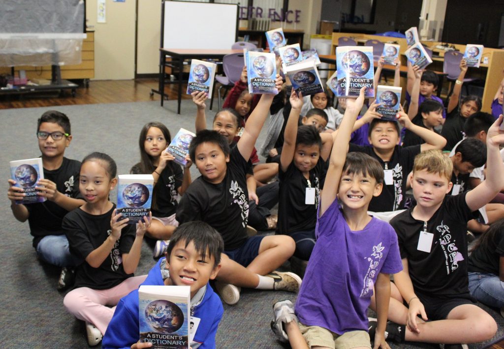 Rotary Club of Pearlridge presents Pearl City Elementary 3rd graders with free dictionaries