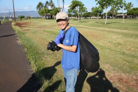 Community volunteers clean-up, paint over graffiti along the Pearl Harbor Bike Path in Pearl City